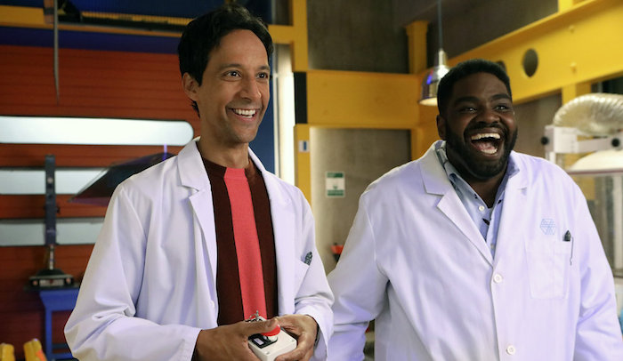 POWERLESS -- "Wayne Dream Team" Episode 103 -- Pictured: (l-r) Danny Pudi as Teddy, Ron Funches as Ron -- (Photo by: Evans Vestal Ward/Warner Bros/NBC)