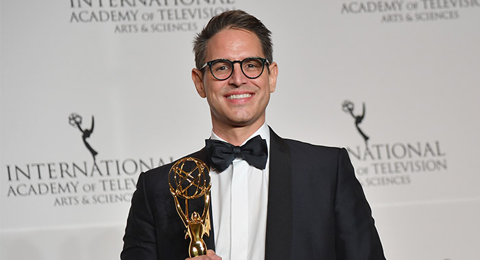 Writer/producer Greg Berlanti poses with Founders Award during the 46th International Emmy Awards