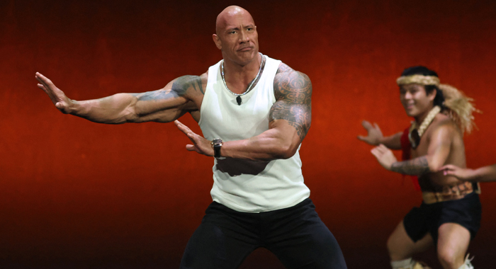 Dwayne Johnson dances onstage during the Walt Disney Studios presentation at CinemaCon 2024