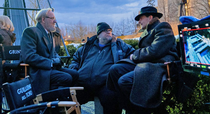 Richard Jenkins, Guillermo del Toro, and Bradley Cooper on the set of Nightmare Alley