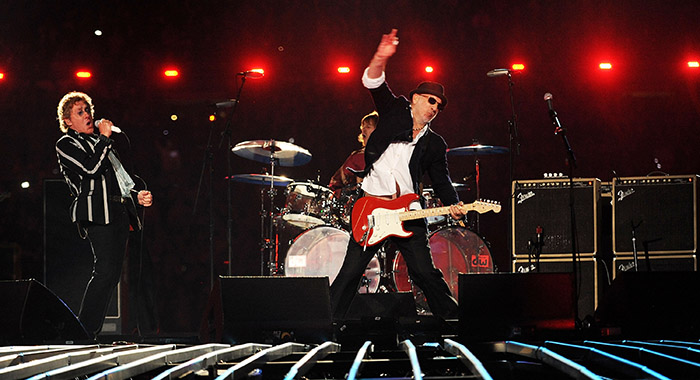 Musicians Roger Daltrey (L) and Pete Townshend of The Who perform onstage during the Super Bowl XLIV Halftime Show