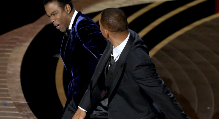 Will Smith slaps Chris Rock on stage at the 94th Academy Awards