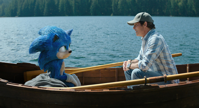 Sonic (voiced by Ben Schwartz) and James Marsden as Tom in Sonic the Hedgehog 2