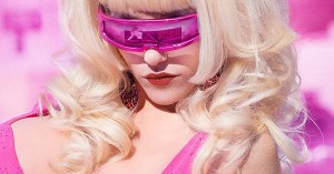 <I>Angelyne</i> Star Emmy Rossum on Portraying the Pink Neon Glimmer of L.A.’s Billboard Queen