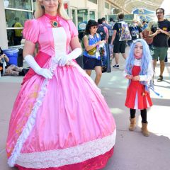 Cosplayers wearing a Princess Peach costume from Super Mario Bros. and Eri from My Hero Academia