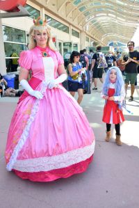 Cosplayers wearing a Princess Peach costume from Super Mario Bros. and Eri from My Hero Academia