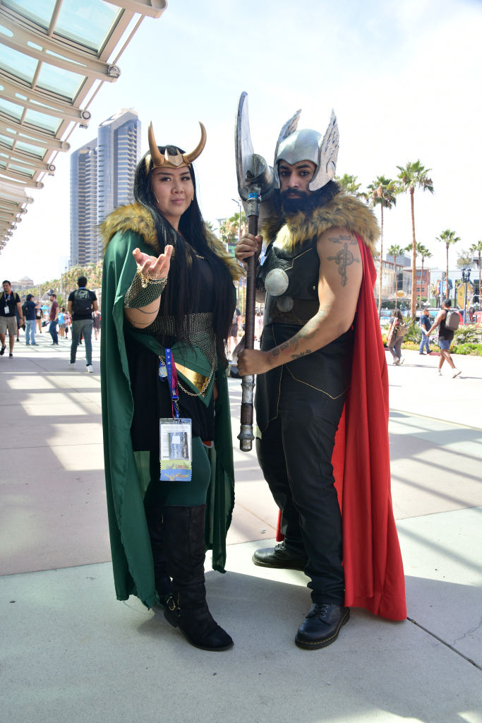 Cosplayers wearing Loki and Thor costumes
