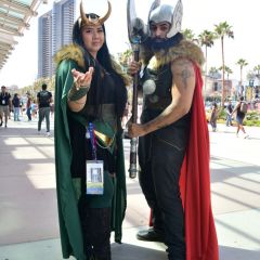 Cosplayers wearing Loki and Thor costumes