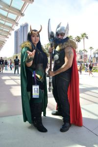 Cosplayers wearing Loki and Thor costumes