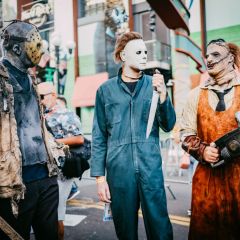 Cosplayers dressed as Jason, Michael Myers, and Leatherface