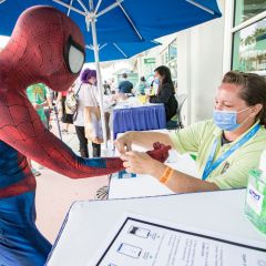 Spiderman cosplayer Sean Sallings gets his vaccine check wristband