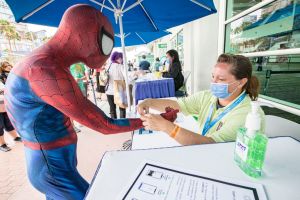 Spiderman cosplayer Sean Sallings gets his vaccine check wristband