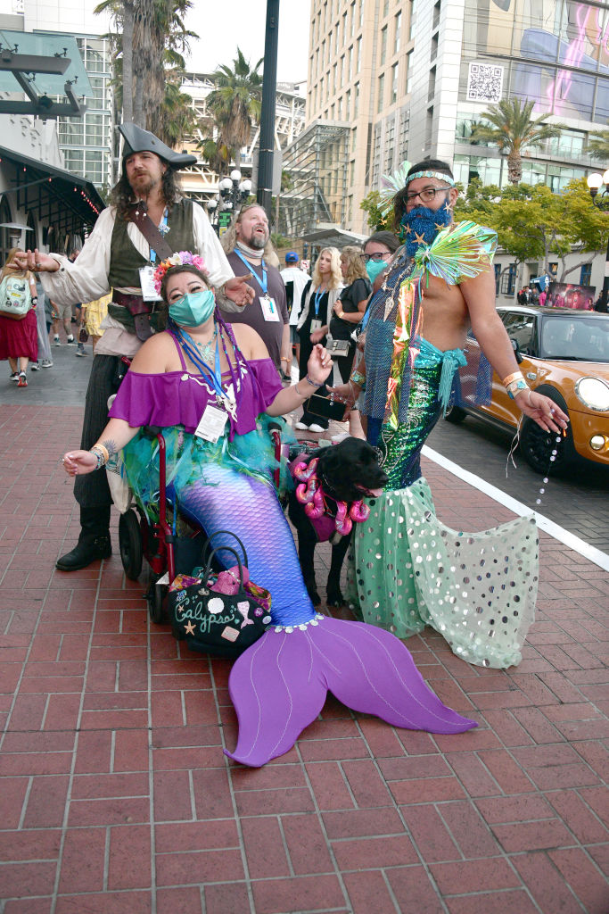 Mermaid and pirate cosplayers
