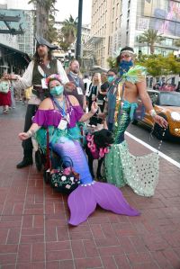 Mermaid and pirate cosplayers