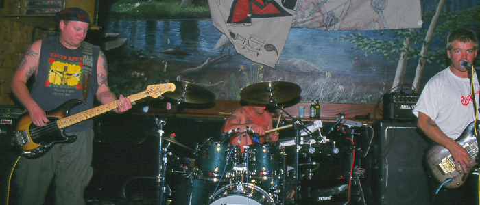 Eric Wilson, Bud Gaugh, and Bradley Nowell of Sublime on stage in 1995