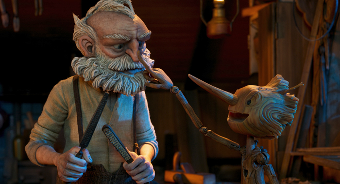 David Bradley and Gregory Mann as the voices of Gepetto and Pinocchio in Guillermo del Toro's Pinocchio (2022)