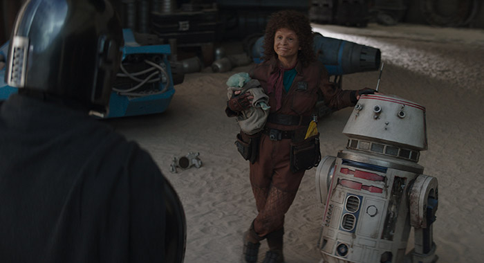 Pedro Pascal, Grogu, and Amy Sedaris in THE MANDALORIAN, season 3