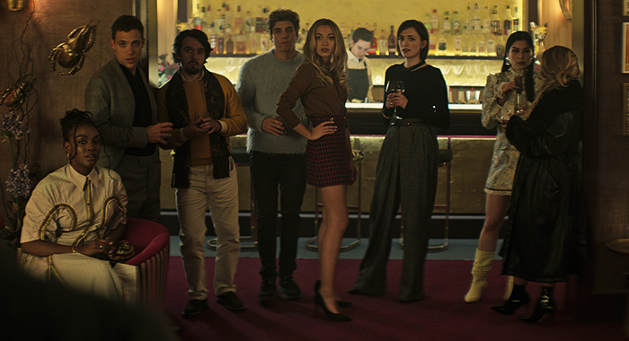 You. (L to R) Ozioma Whenu as Blessing, Ben Wiggins as Roald, Dario Coates as Connie, Lukas Gage as Adam, Tilly Keeper as Lady Phoebe, Charlotte Ritchie as Kate and Niccy Lin as Sophie Soo in episode 403 of You. Cr. Courtesy of Netflix © 2022