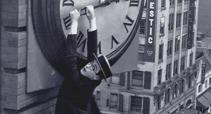 Harold Lloyd hanging from a clock tower in Safety Last! (1923)