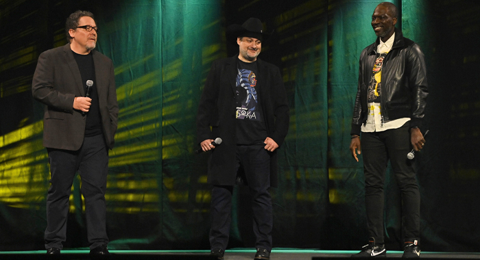 John Favreau, Dave Filoni and Rick Famuyiwa onstage during the studio panel for The Mandalorian at Star Wars Celebration 2023