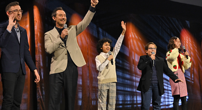 Host Ali Plumb, Jude Law, Ravi Cabot Conyers, Robert Timothy Smith and Kyrianna Kratter onstage during the studio panel for Skeleton Crew at the Star Wars Celebration 2023