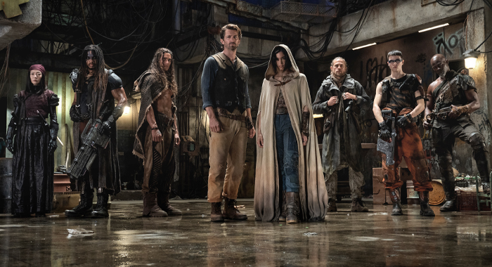 Doona Bae as Nemesis, Ray Fisher as Bloodaxe, Staz Nair as Tarak, Charlie Hunnam as Kai, Sofia Boutella as Kora, Michiel Huisman as Gunnar, E. Duffy as Milius, and Djimon Hounsou as Titus in Rebel Moon (2023)