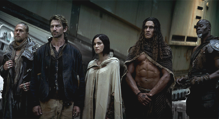 Charlie Hunnam as Kai, Michiel Huisman as Gunnar, Sofia Boutella as Kora, Staz Nair as Tarak, and Djimon Hounsou as Titus in Rebel Moon (2023)