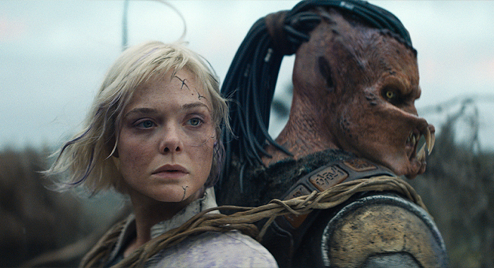 Elle Fanning and Dimitrius Schuster-Koloamatangi in Predator: Badlands (2025)