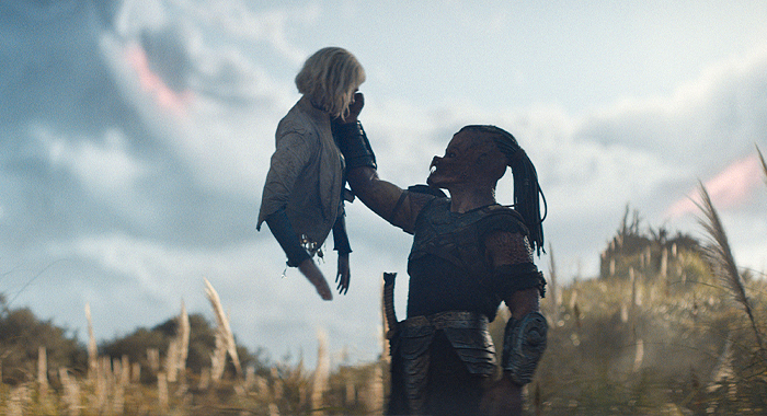 Elle Fanning and Dimitrius Schuster-Koloamatangi in Predator: Badlands (2025)