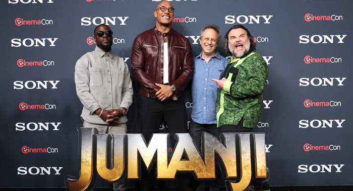 Kevin Hart, Dwayne Johnson, director Jake Kasdan, and Jack Black at a photo call for Jumanji: Open World (2026) at CinemaCon 2026
