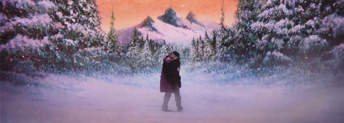 two people kissing in the snow